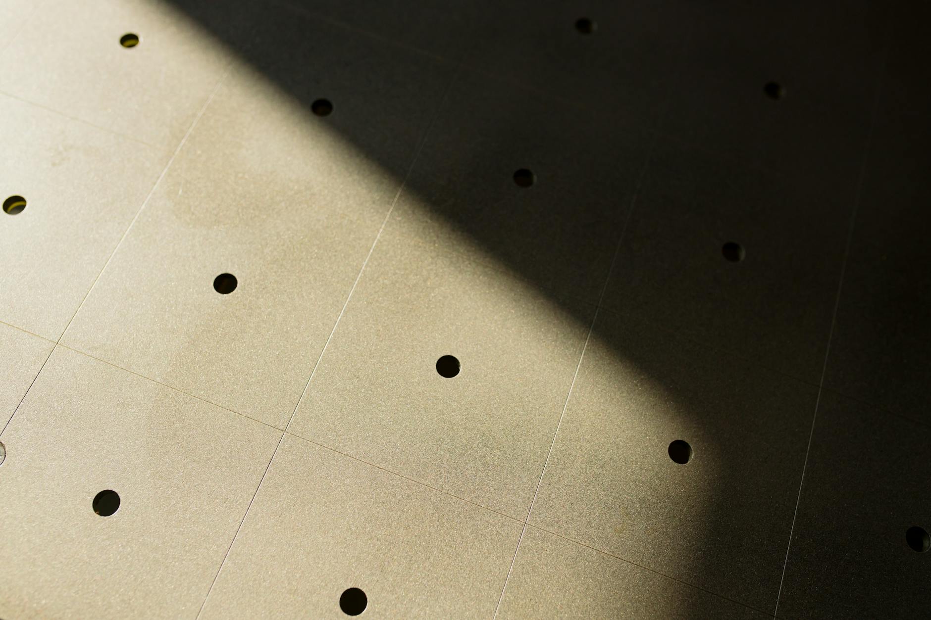 Fine dot grid pattern on warm cream background